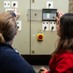 Energy Sparks team member and school staff member look at the school's heating settings.